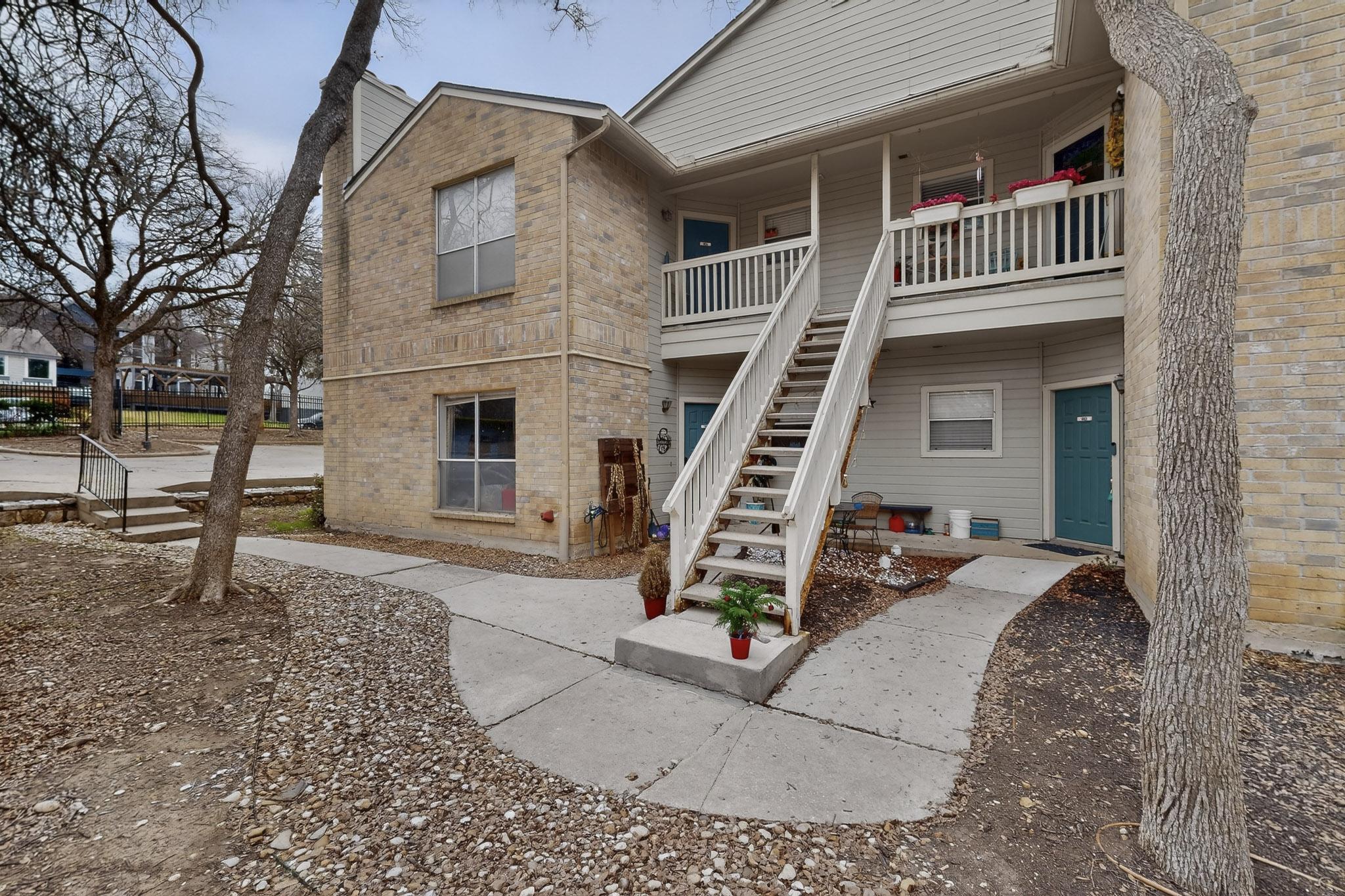 2450 Wickersham Lane, Unit 904 Austin, TX 78741 - Photo 29 of 35 front view of a house with a slide