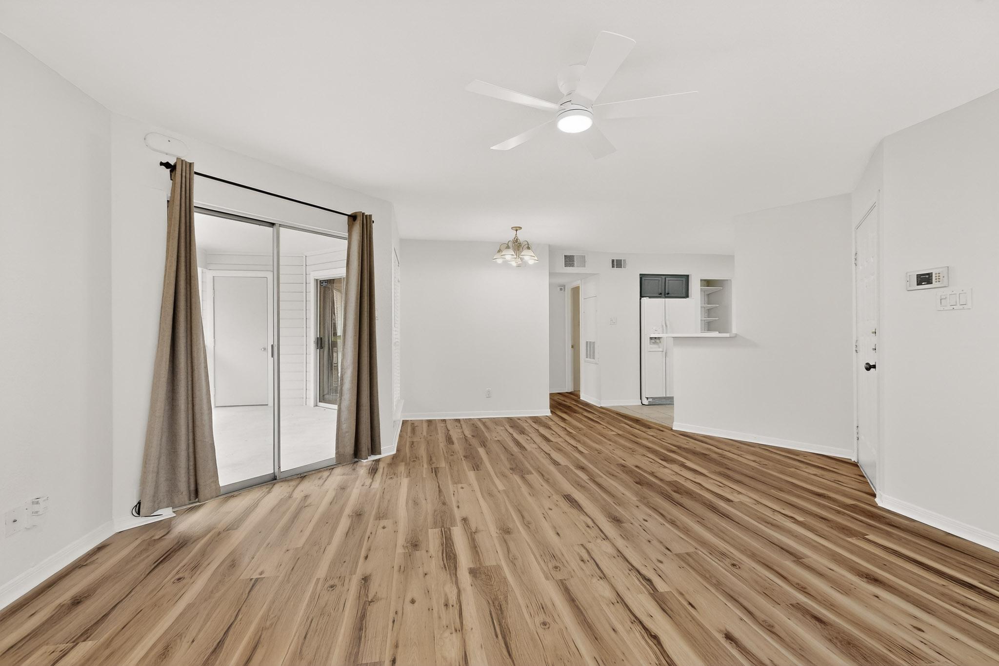 2450 Wickersham Lane, Unit 904 Austin, TX 78741 - Photo 3 of 35 a view of empty room with wooden floor