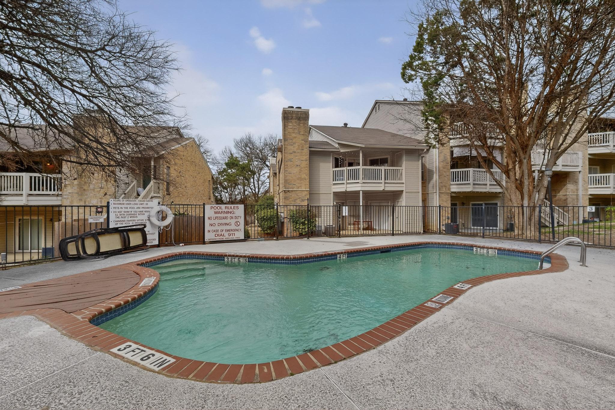 2450 Wickersham Lane, Unit 904 Austin, TX 78741 - Photo 33 of 35 a view of a house with swimming pool and sitting area