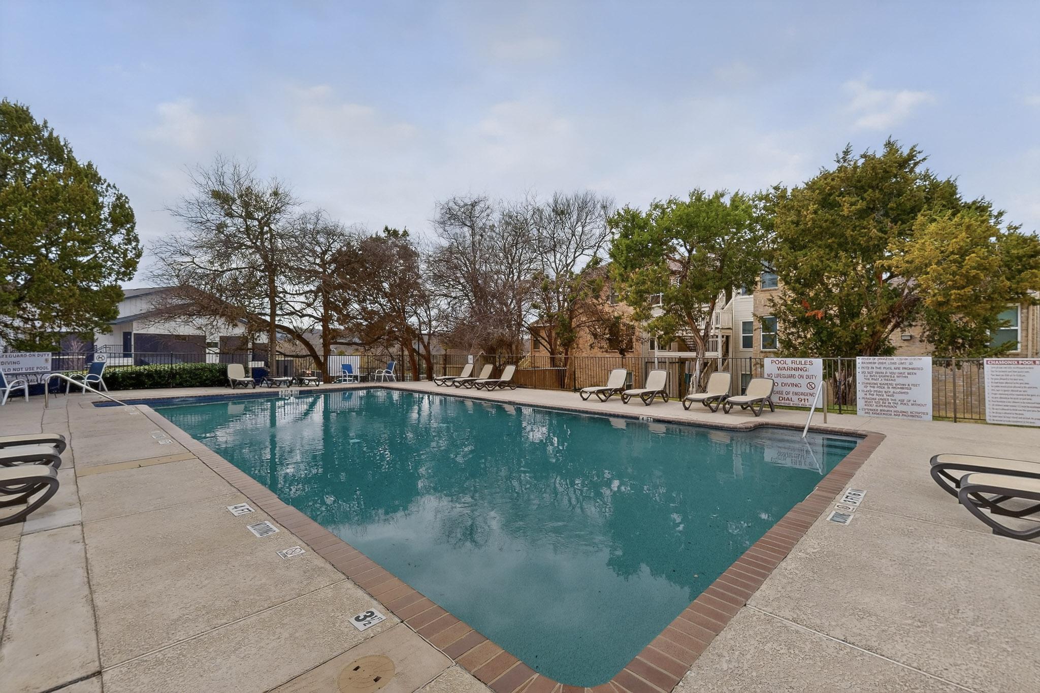 2450 Wickersham Lane, Unit 904 Austin, TX 78741 - Photo 34 of 35 a view of a swimming pool with a patio