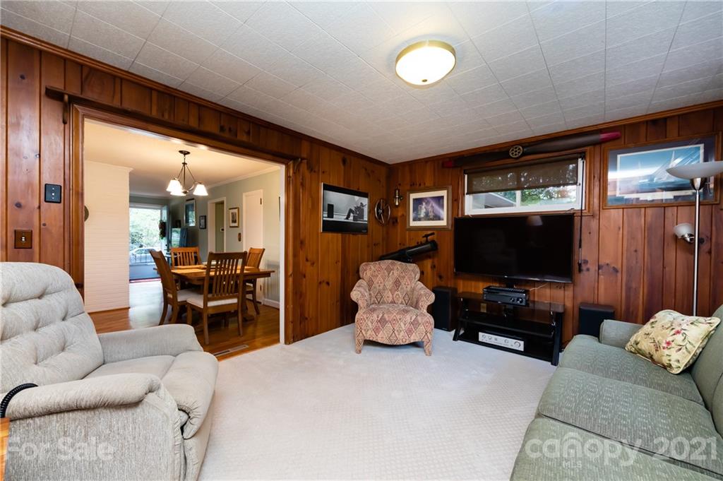 731 Lochridge Road Charlotte, NC 28209 - Photo 12 of 31 a living room with furniture and a flat screen tv