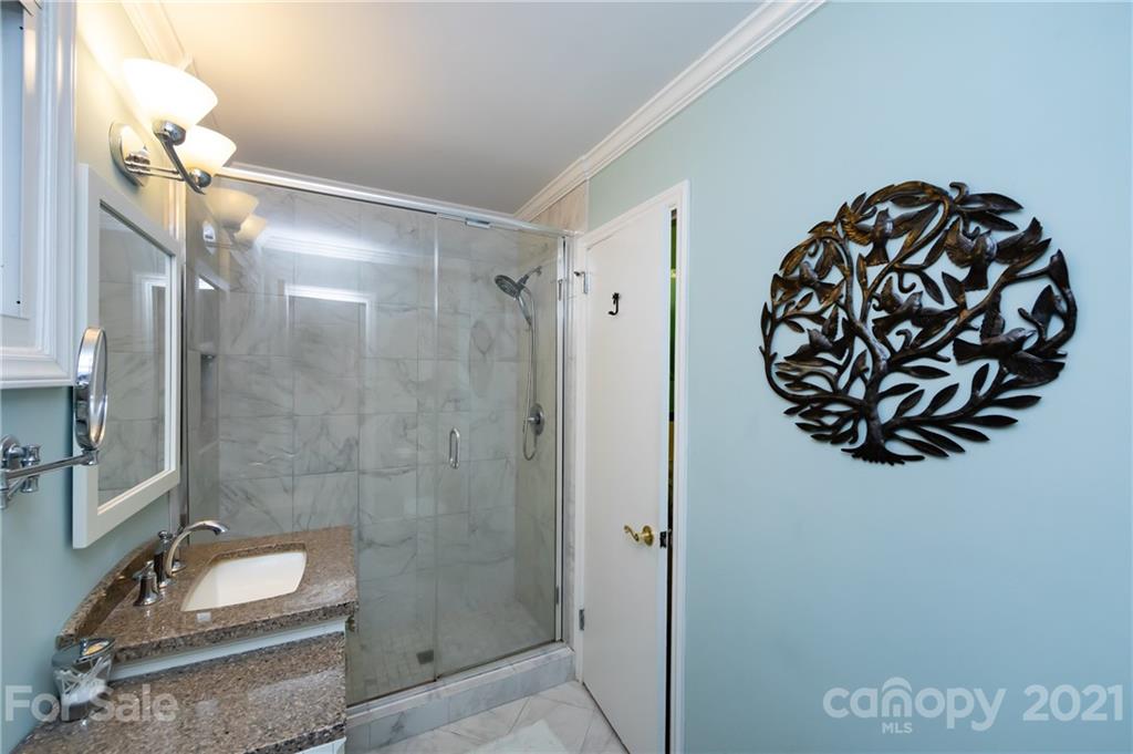 731 Lochridge Road Charlotte, NC 28209 - Photo 15 of 31 a bathroom with a sink and mirror
