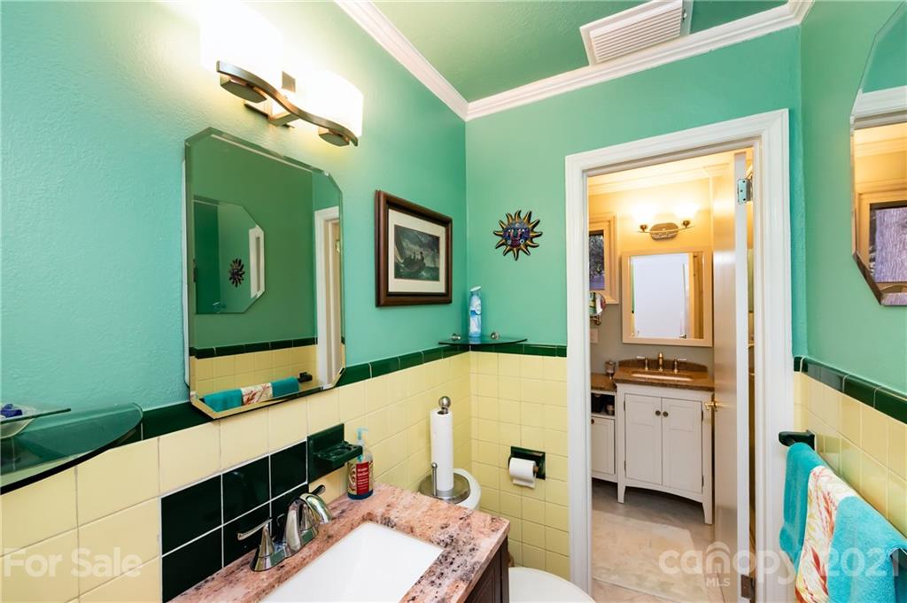 731 Lochridge Road Charlotte, NC 28209 - Photo 18 of 31 a bathroom with a tub sink and mirror