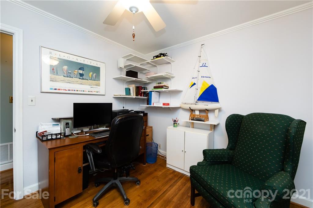 731 Lochridge Road Charlotte, NC 28209 - Photo 20 of 31 a workspace with furniture and wooden floor