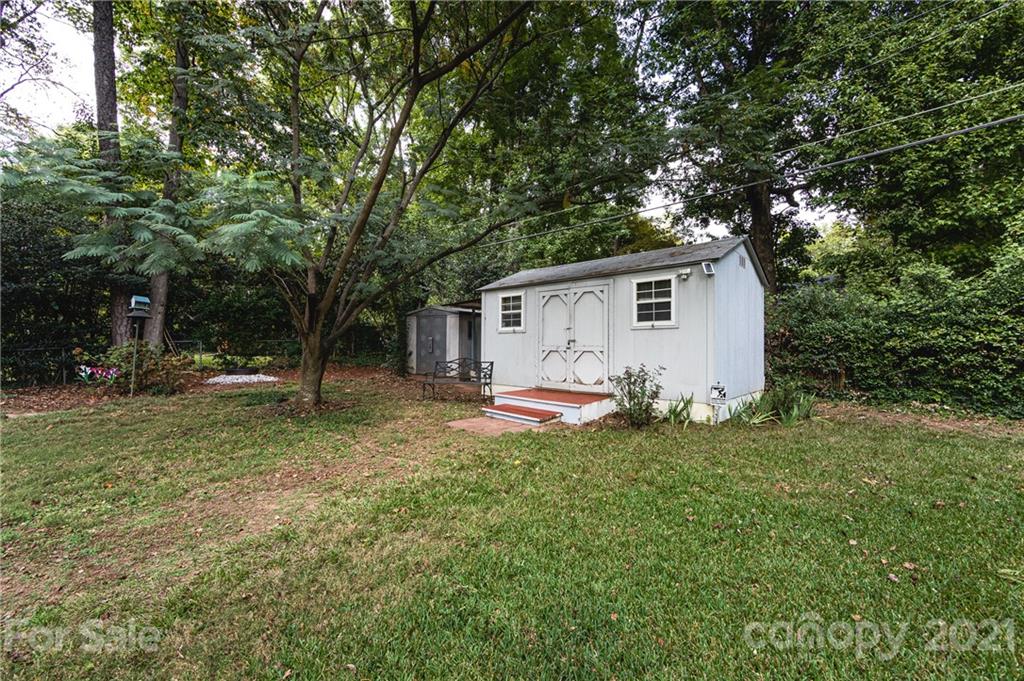 731 Lochridge Road Charlotte, NC 28209 - Photo 23 of 31 a view of a house with a backyard
