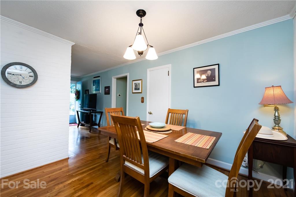 731 Lochridge Road Charlotte, NC 28209 - Photo 4 of 31 a view of a dining room with furniture and wooden floor