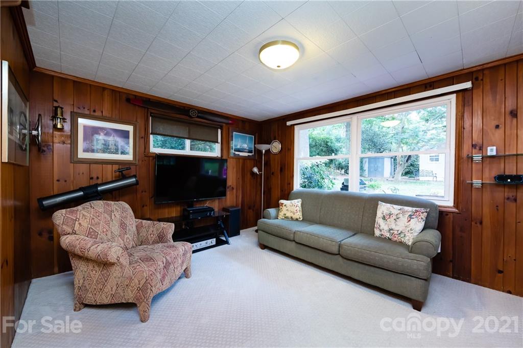 731 Lochridge Road Charlotte, NC 28209 - Photo 10 of 31 a living room with furniture and a flat screen tv