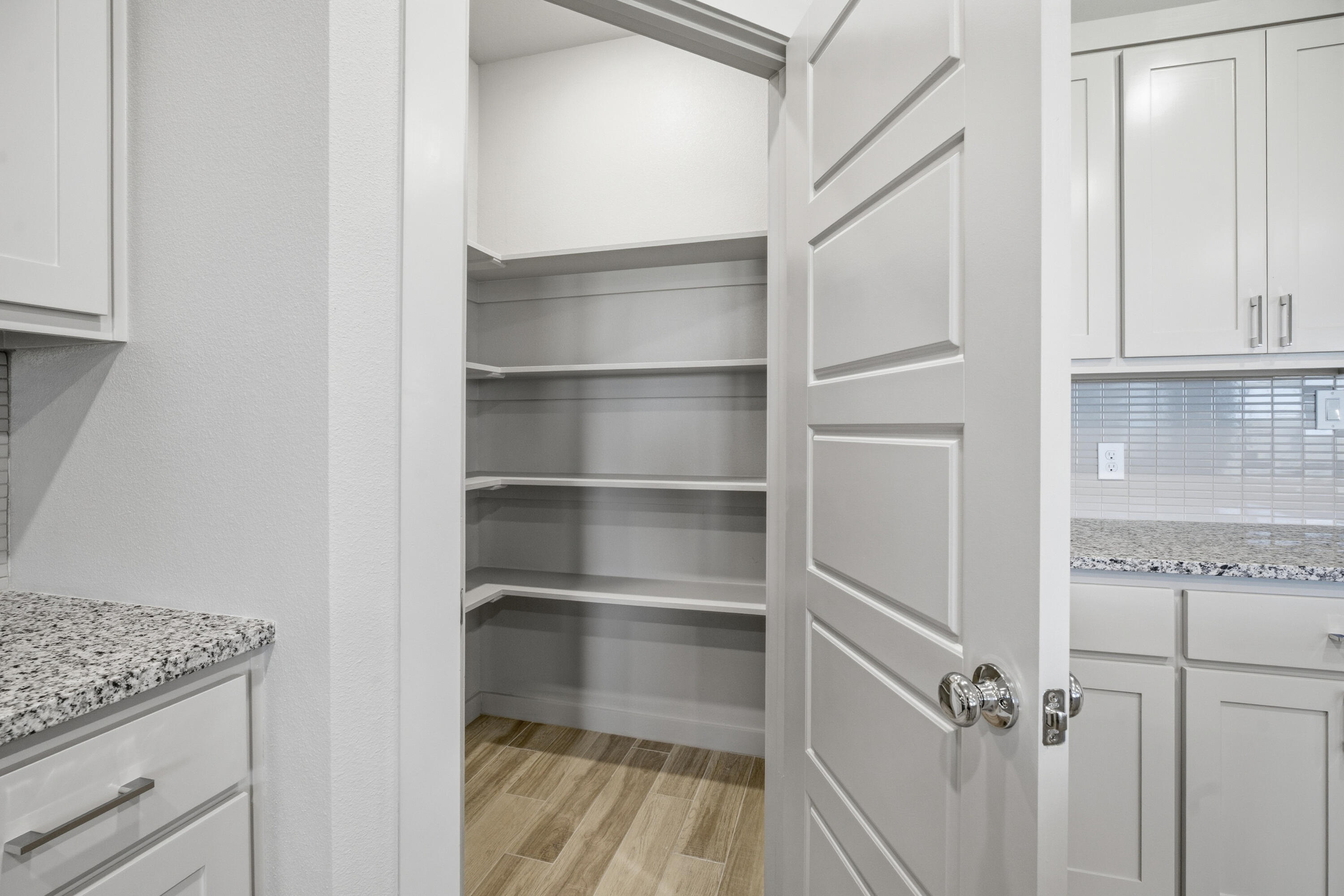616 East 13th Street Wolfforth, TX 79382 - Photo 13 of 34 a view of walk in closet with empty racks