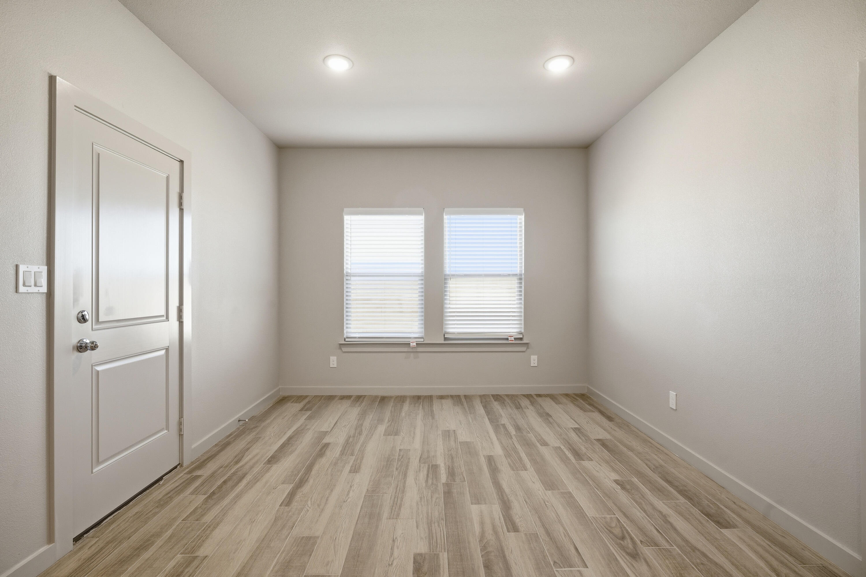 616 East 13th Street Wolfforth, TX 79382 - Photo 14 of 34 wooden floor in an empty room with a window