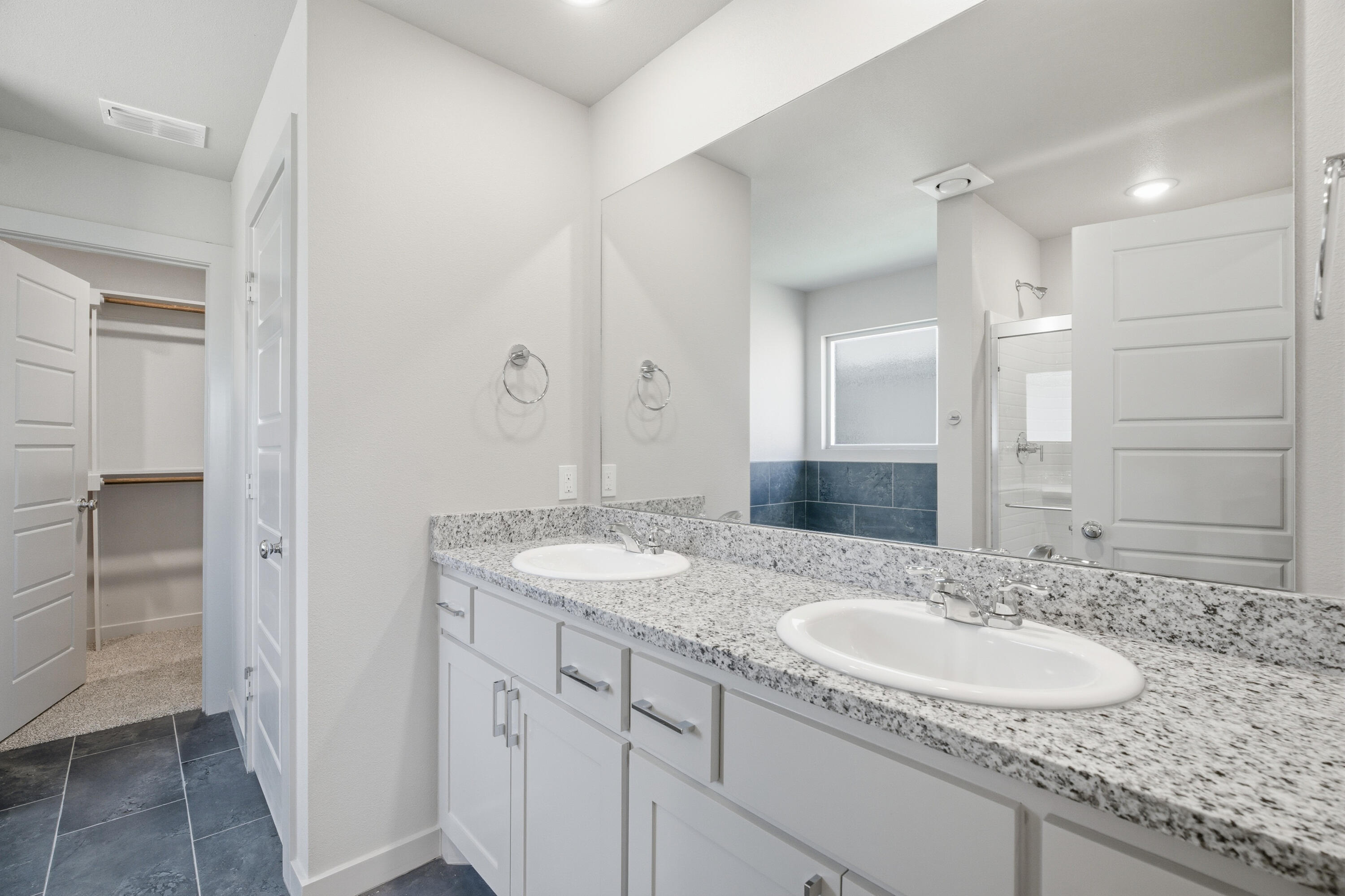 616 East 13th Street Wolfforth, TX 79382 - Photo 19 of 34 a bathroom with a granite countertop sink and a mirror