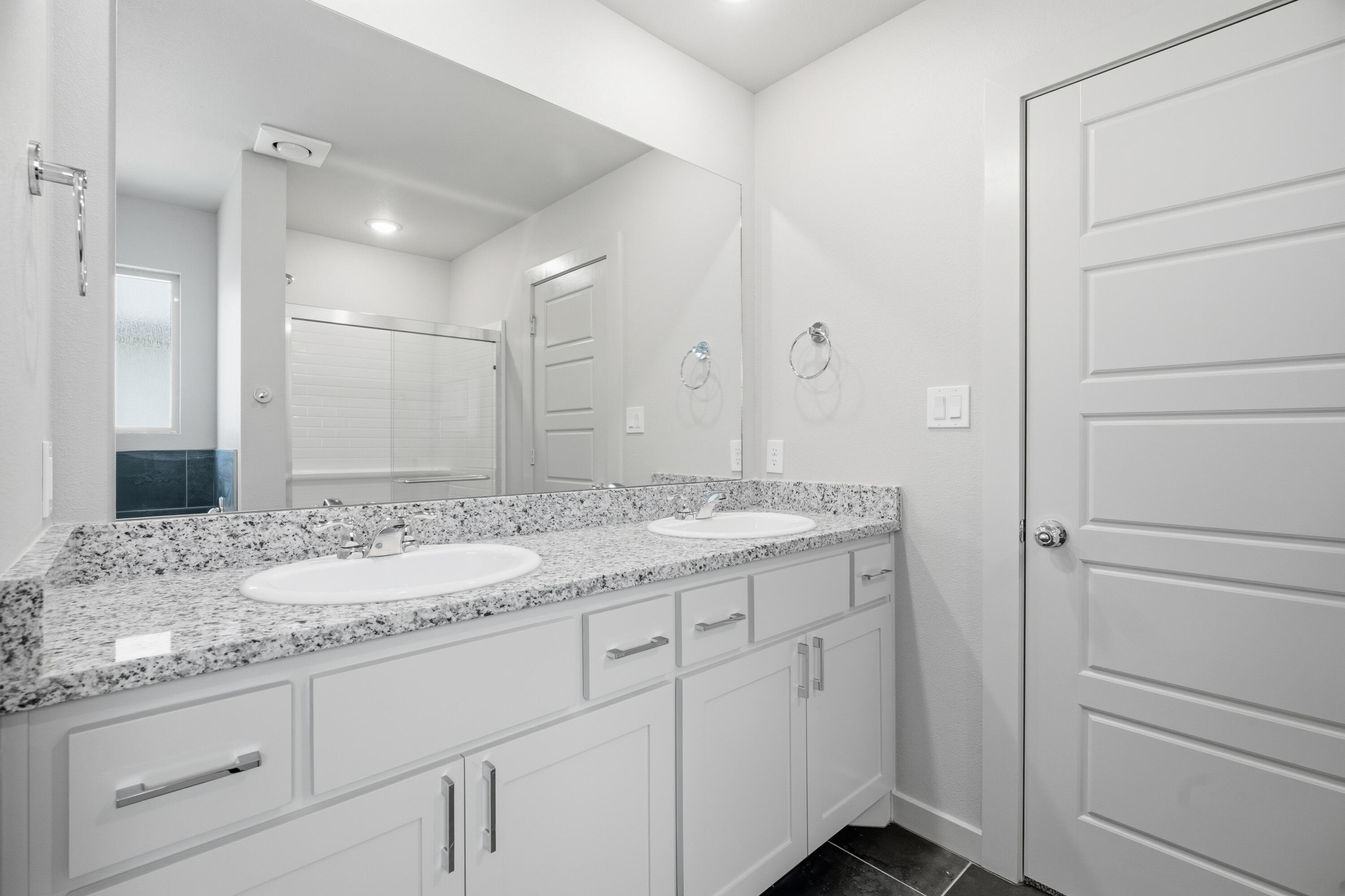 616 East 13th Street Wolfforth, TX 79382 - Photo 20 of 34 a bathroom with a granite countertop sink and a mirror
