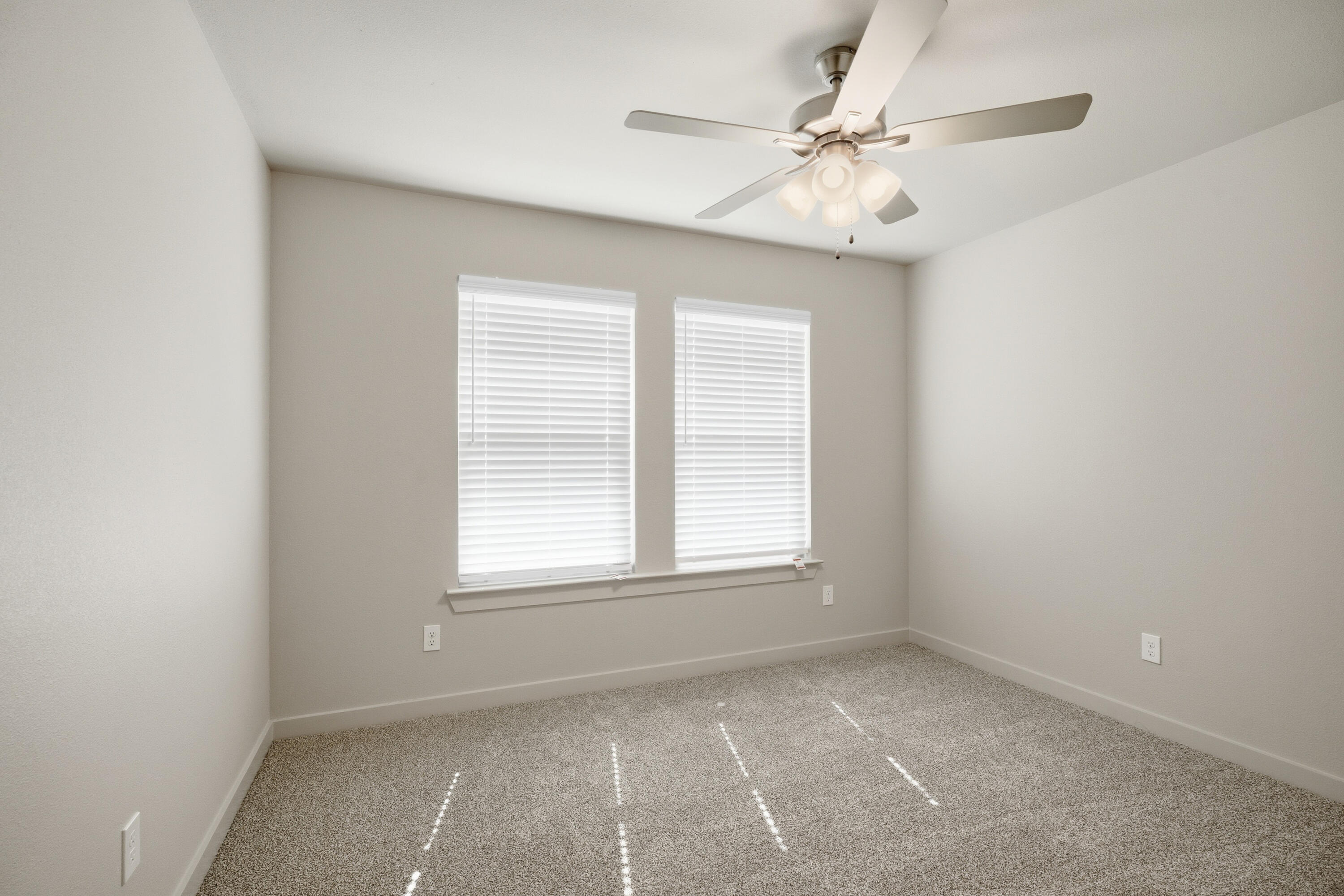 616 East 13th Street Wolfforth, TX 79382 - Photo 24 of 34 an empty room with windows and fan