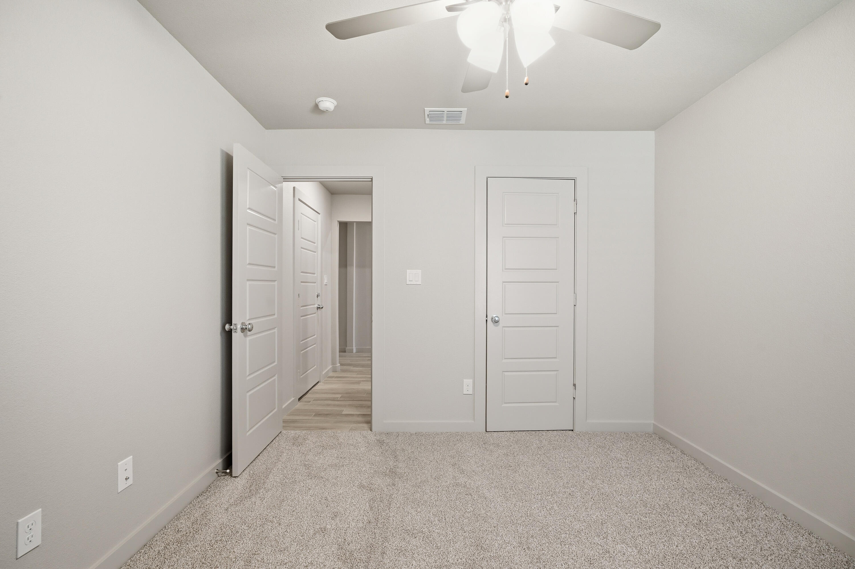 616 East 13th Street Wolfforth, TX 79382 - Photo 27 of 34 an empty room with a empty space and a ceiling fan