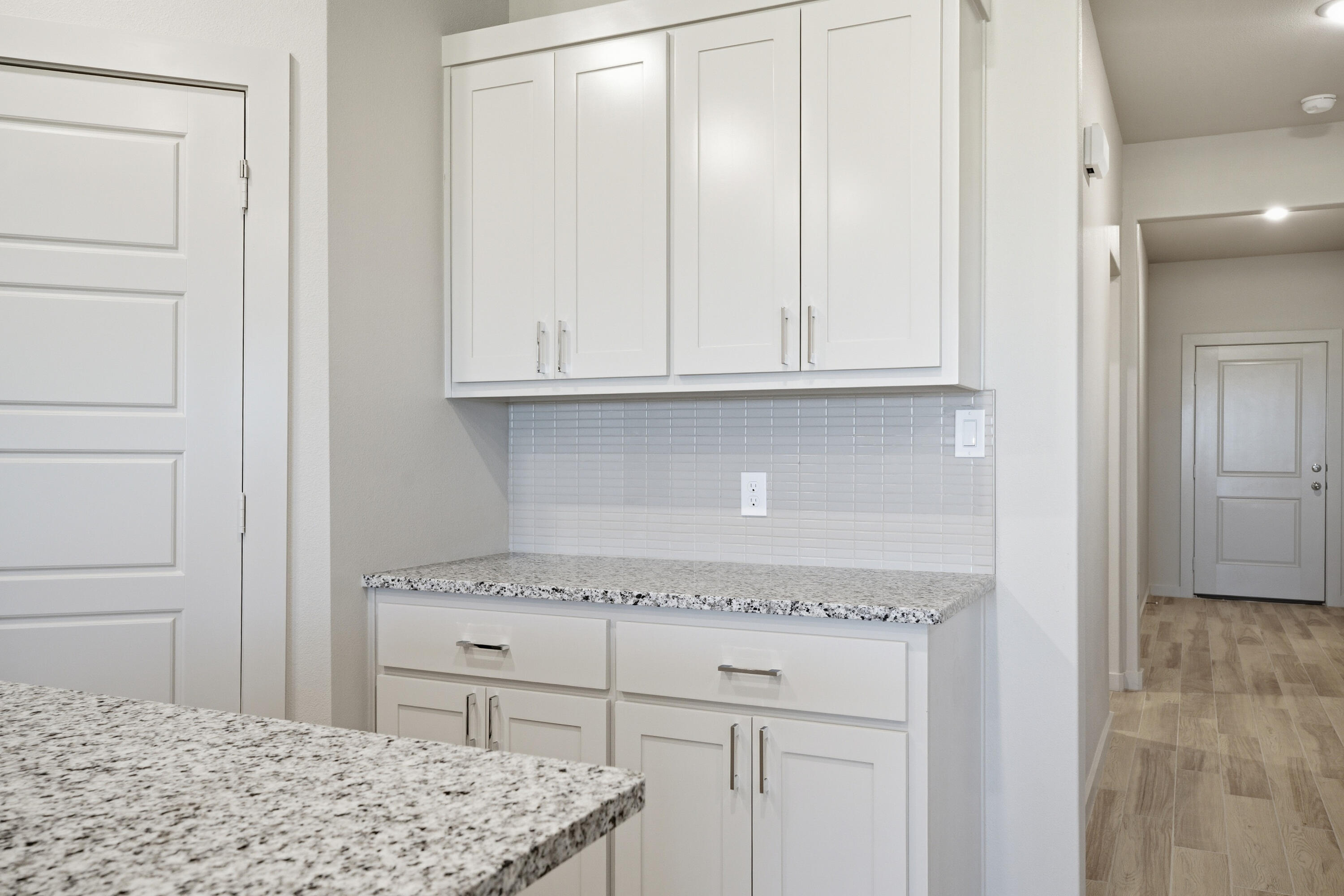 616 East 13th Street Wolfforth, TX 79382 - Photo 9 of 34 a view of kitchen with granite countertop cabinets