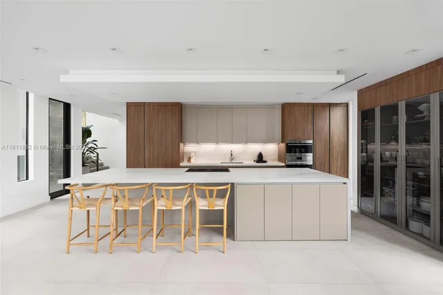 a bathroom with a double vanity sink mirror and shower