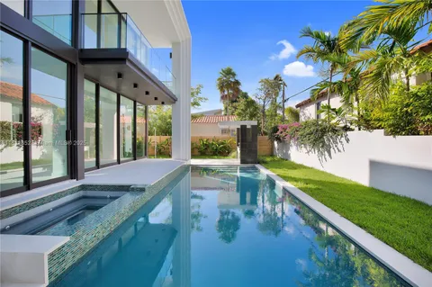 an empty room with large windows