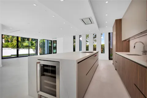 a bathroom with a double vanity sink mirror and shower