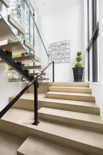 a view of a kitchen with microwave and refrigerator