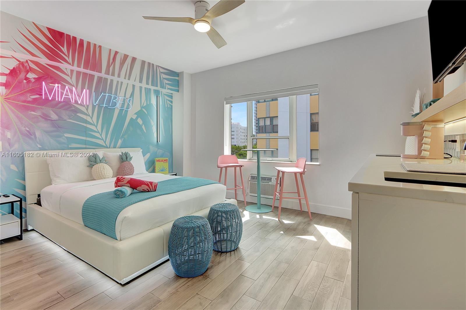 255 West 24th Street, Unit 308 Miami Beach, FL 33140 - Photo 1 of 31 a bedroom with a bed and a flat screen tv