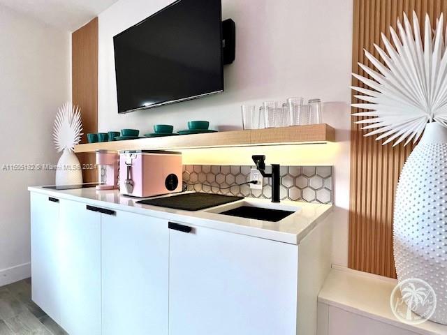 255 West 24th Street, Unit 308 Miami Beach, FL 33140 - Photo 12 of 31 a view of living room with furniture and a flat screen tv