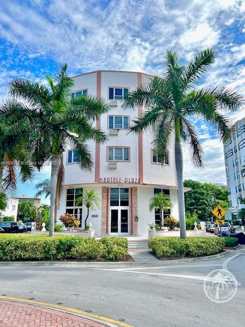 255 West 24th Street, Unit 308 Miami Beach, FL 33140 - Photo 18 of 31 front view of a building with a garden