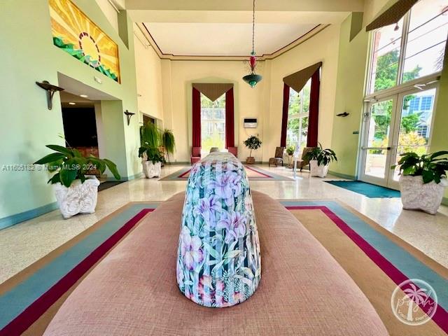 255 West 24th Street, Unit 308 Miami Beach, FL 33140 - Photo 29 of 31 a living room with furniture and a flat screen tv