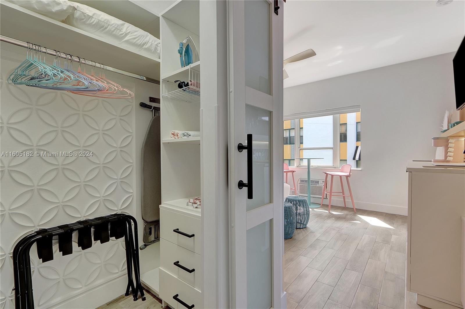 255 West 24th Street, Unit 308 Miami Beach, FL 33140 - Photo 5 of 31 a view of a walk in closet and bedroom