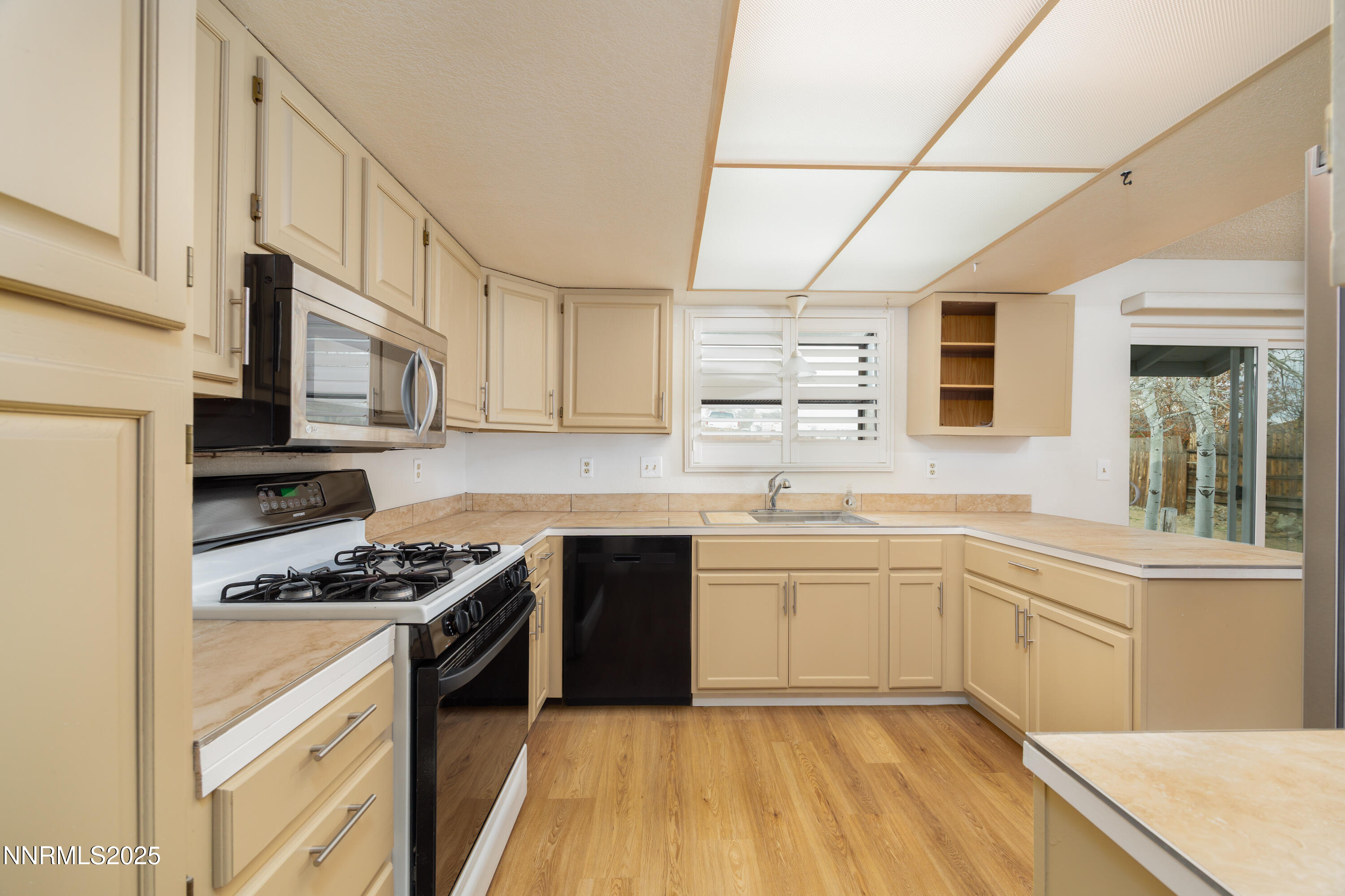 375 Hoge Road Reno, NV 89506 - Photo 2 of 36 a kitchen with stainless steel appliances granite countertop a stove and a sink
