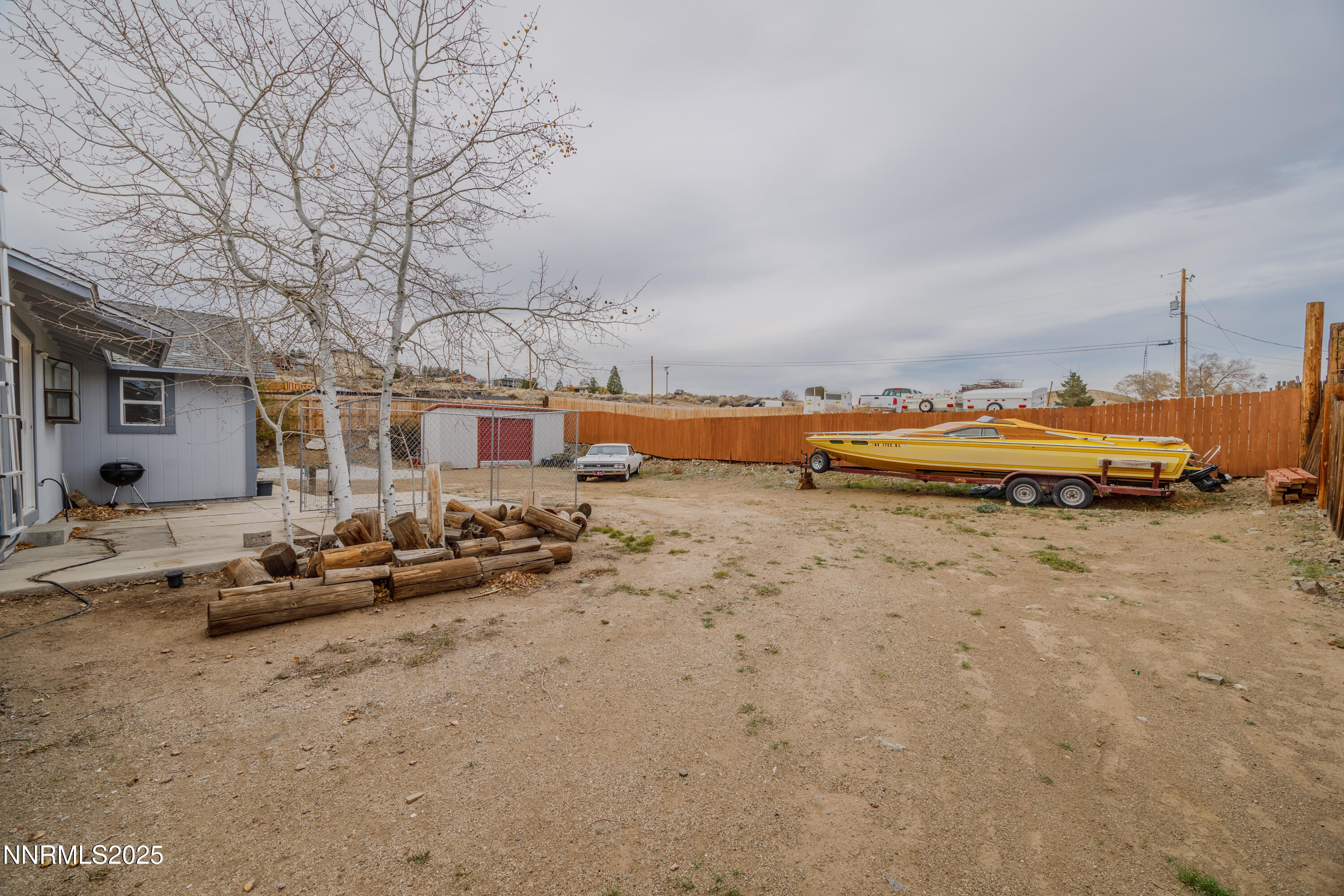 375 Hoge Road Reno, NV 89506 - Photo 24 of 36 a view of a lake with lawn chairs and large trees