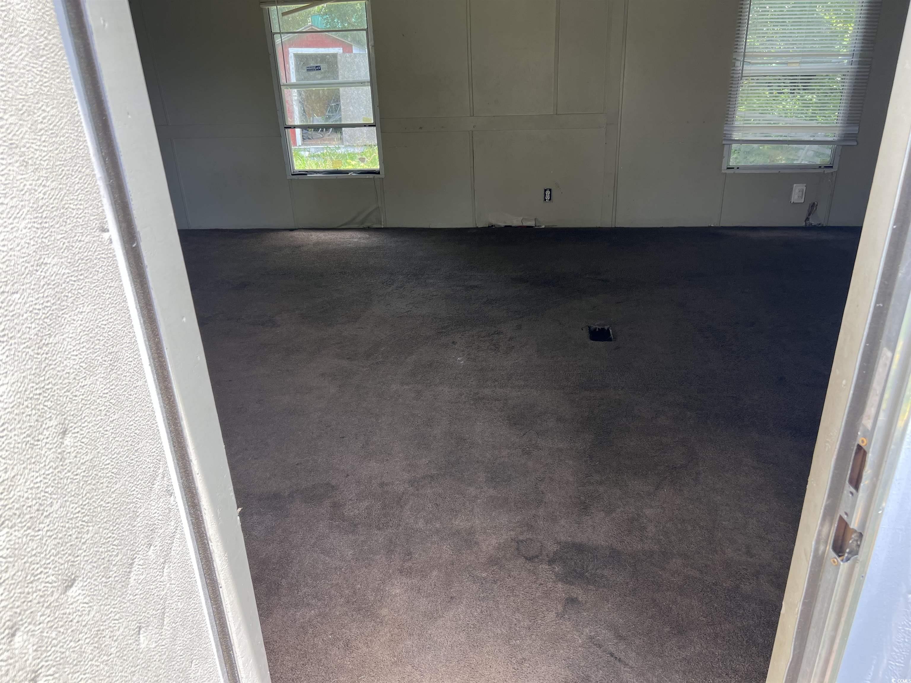 1118 Decatur Street Northeast Orangeburg, SC 29118 - Photo 6 of 14 Unfurnished room featuring dark colored carpet