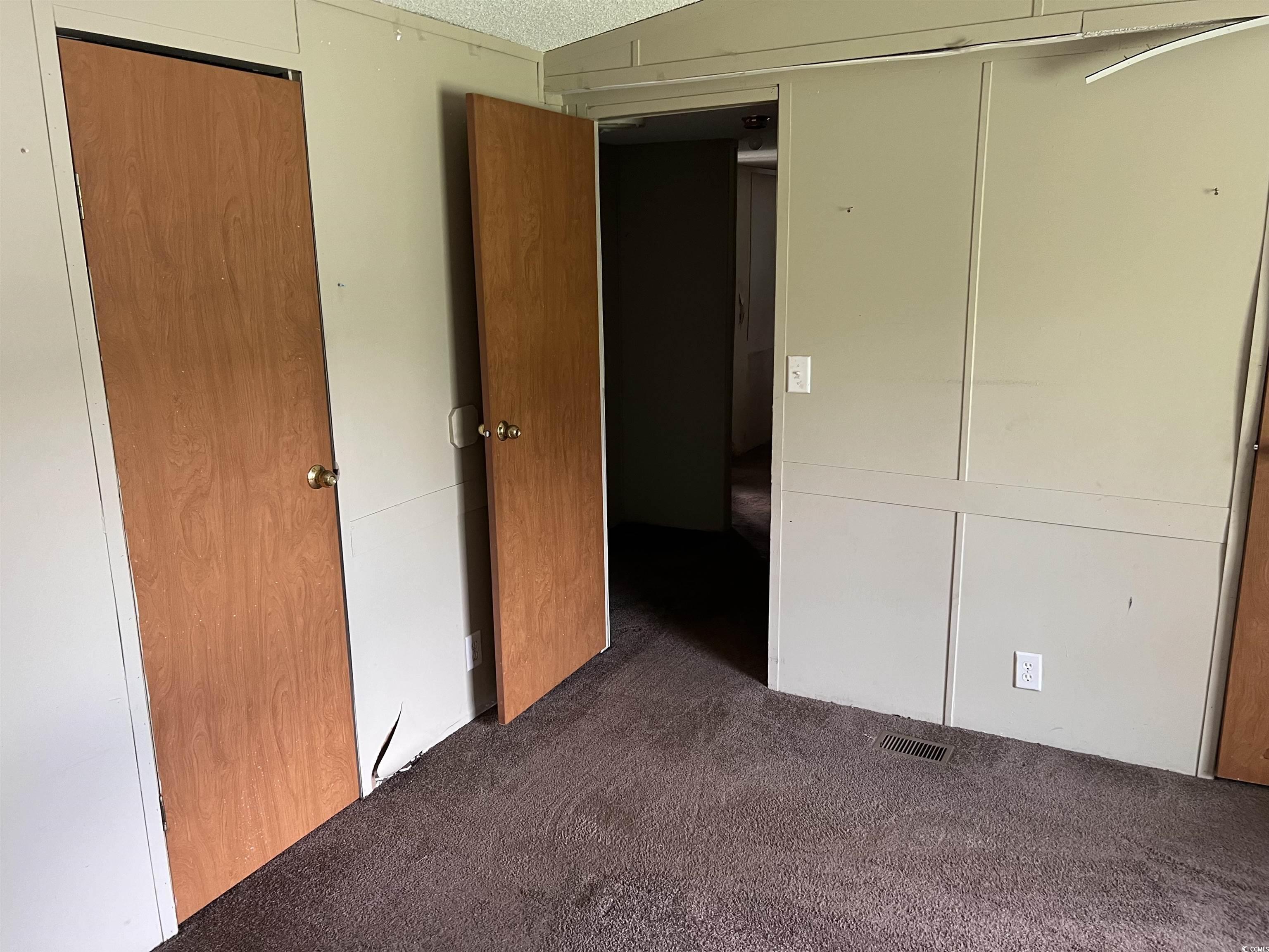 1118 Decatur Street Northeast Orangeburg, SC 29118 - Photo 7 of 14 Unfurnished bedroom with carpet flooring and a closet