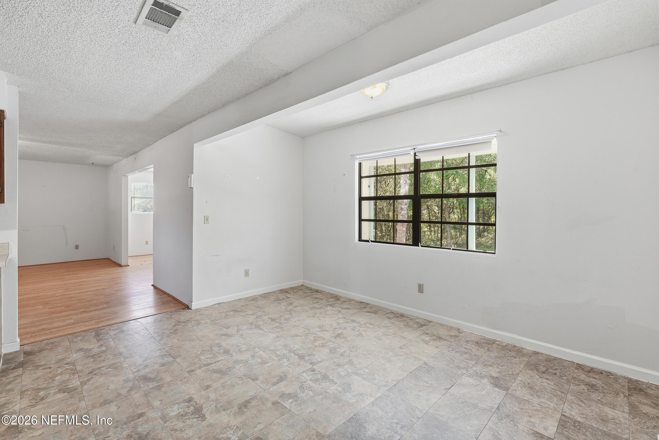 7593 Silver Sands Road Keystone Heights, FL 32656 - Photo 15 of 36 an empty room with windows