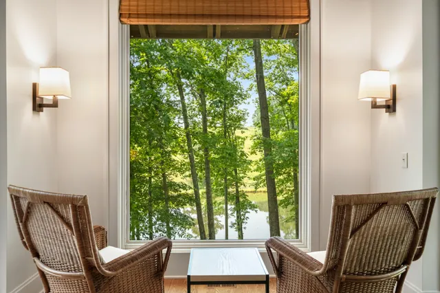 a large kitchen with a large counter top stainless steel appliances and cabinets