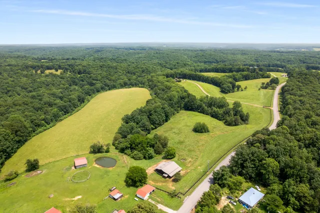 a view of a swimming pool with an outdoor seating and yard