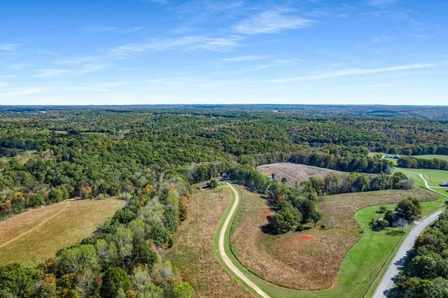 a view of park with wooden fence