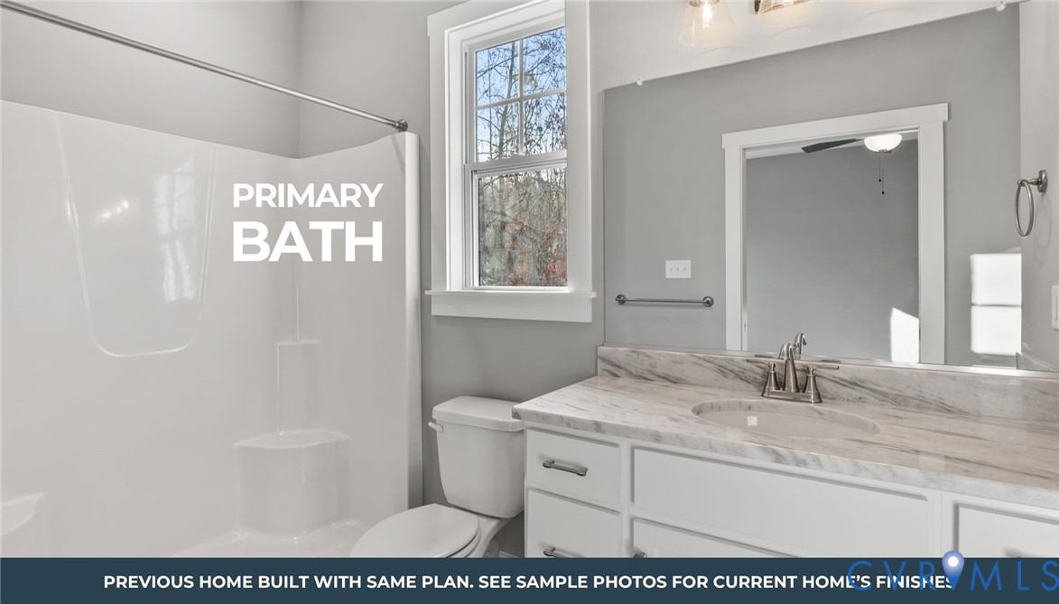 435 Raleigh Avenue South Hill, VA 23970 - Photo 6 of 11 a bathroom with a sink a toilet and a mirror