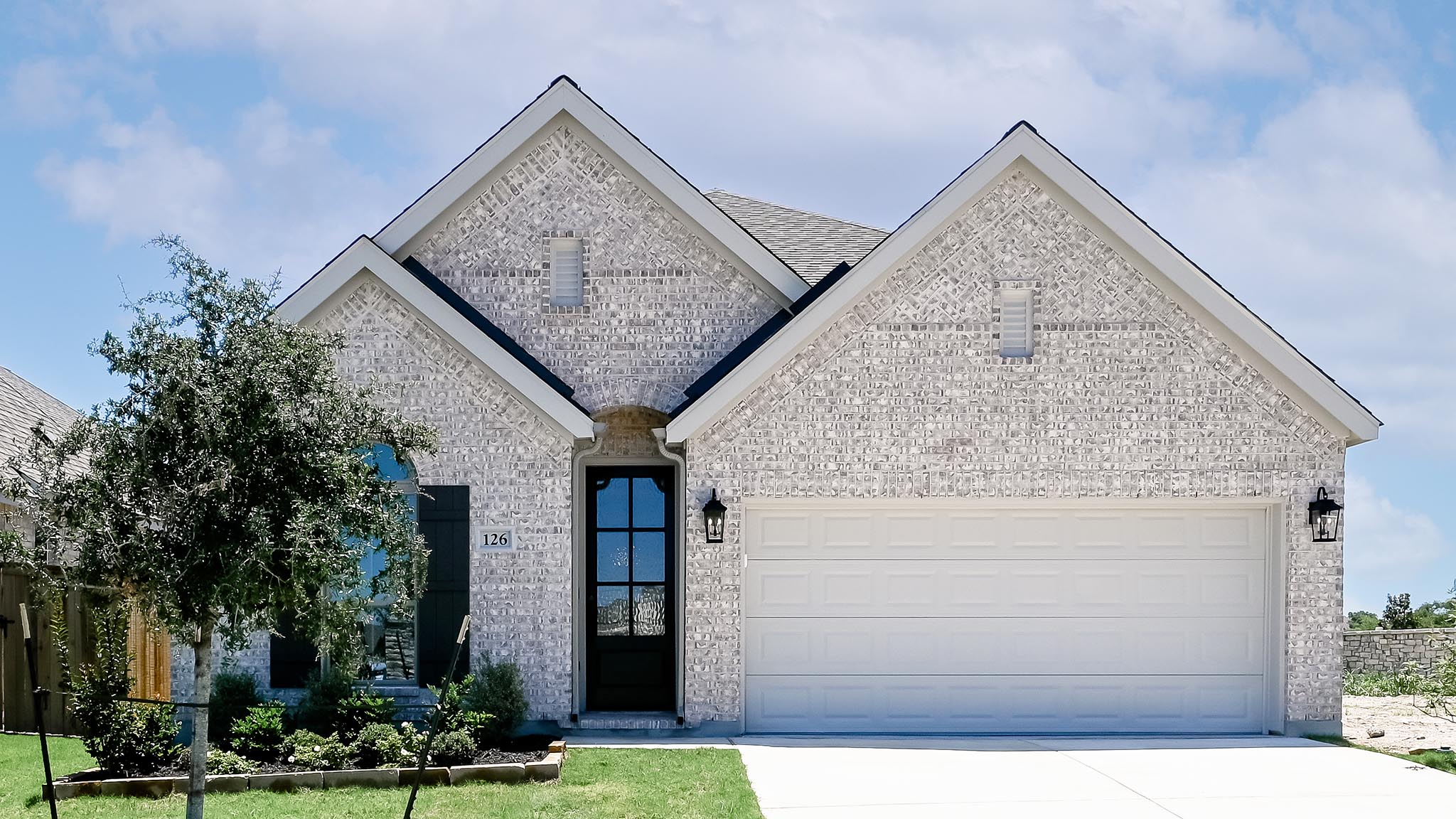 126 Basket Flower Loop Kyle, TX 78640 - Photo 2 of 29 front view of a house with a sink