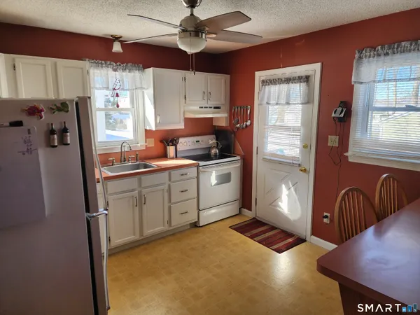 a kitchen with cabinets and window