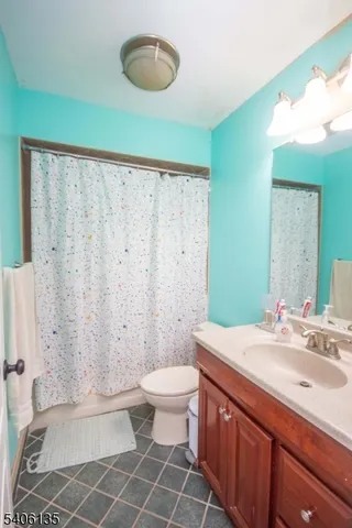 a bedroom with a bed and a table