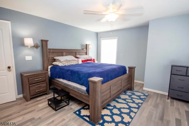 a spacious bathroom with a bathtub and a sink