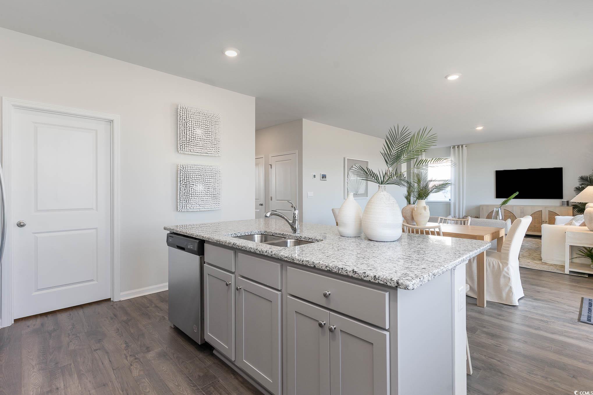 113 Cottage Red Court Conway, SC 29527 - Photo 8 of 26 Kitchen with gray cabinetry, light stone countertops, an island with sink, dishwasher, and dark wood-style flooring