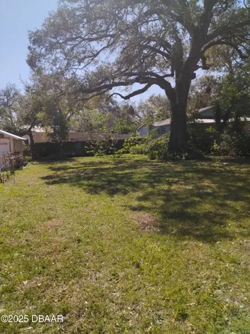 a view of a yard with an outdoor space