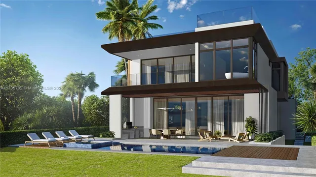 a front view of house with a yard and potted plants