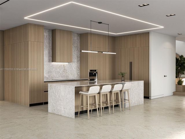 a kitchen with a table and chairs