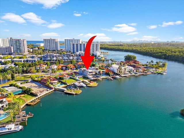 a room with lots of residential buildings and ocean view