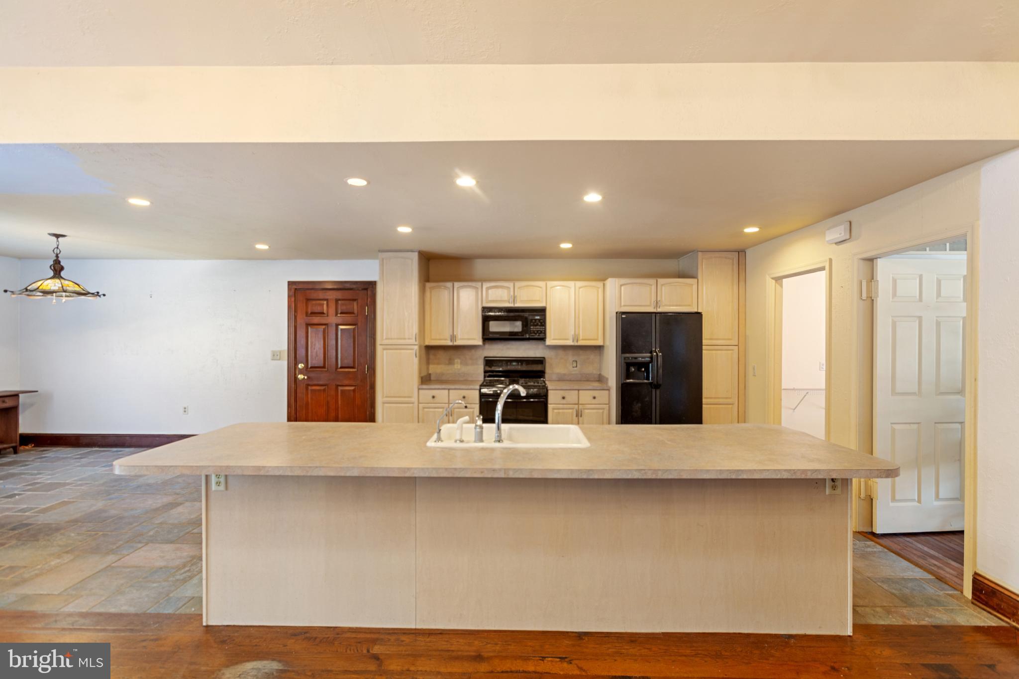 15 Baltray Road Dover, DE 19904 - Photo 19 of 59 a large kitchen with stainless steel appliances a large counter top