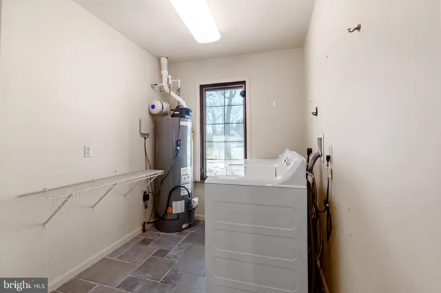 a bathroom with a sink vanity and toilet