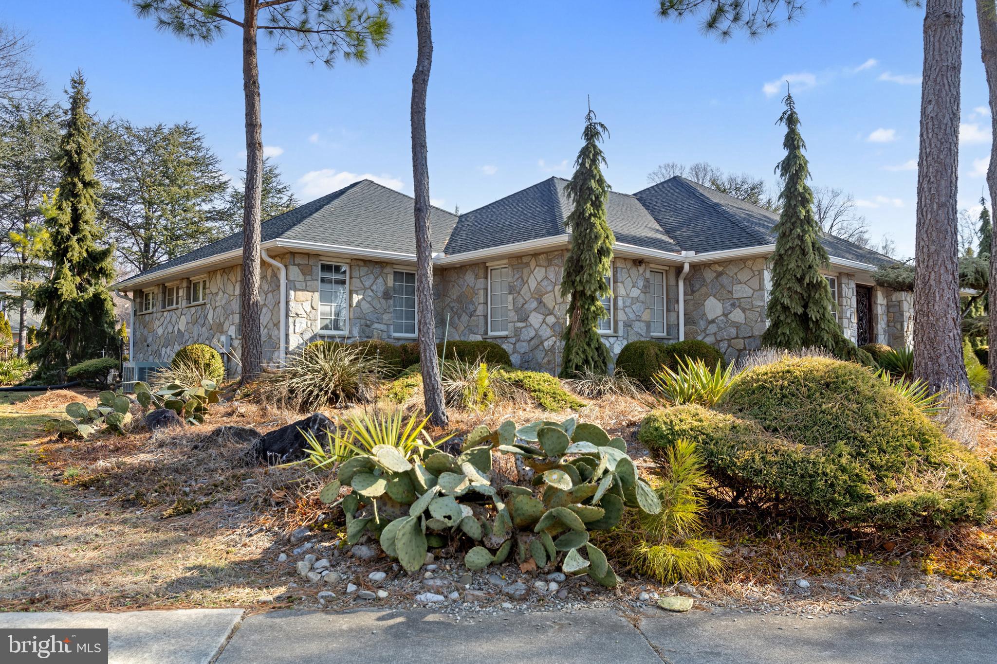 15 Baltray Road Dover, DE 19904 - Photo 3 of 59 a front view of house with yard and trees around