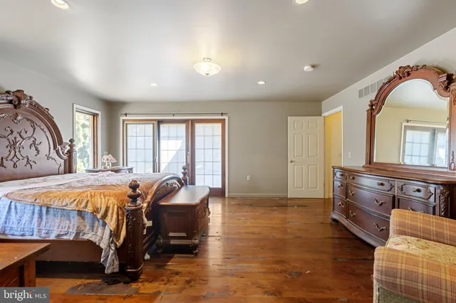 a white toilet sitting next to a shower