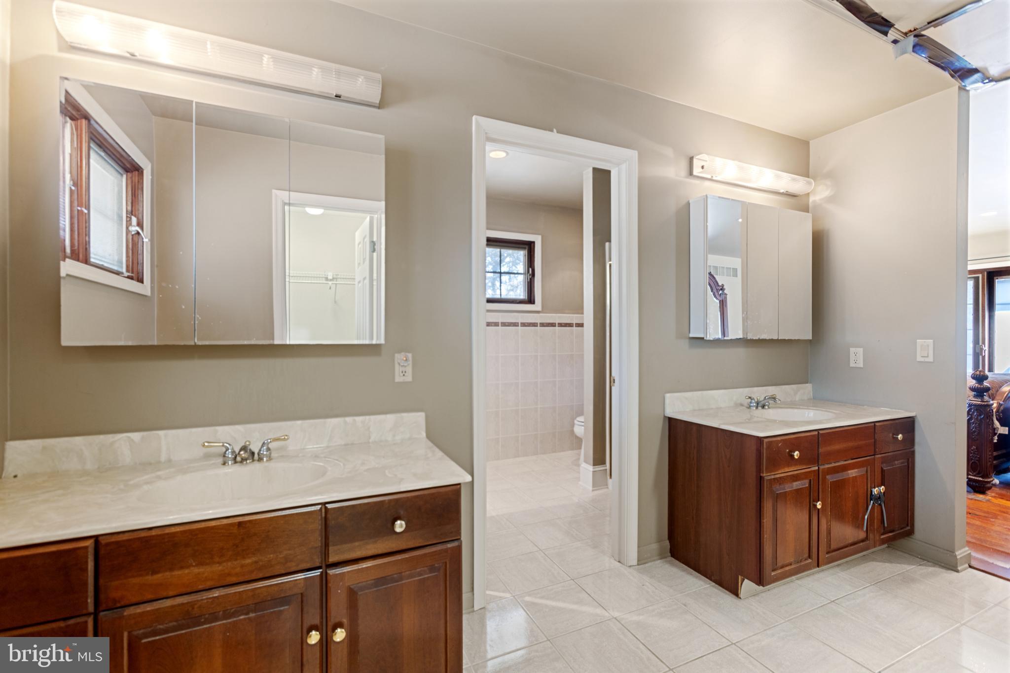15 Baltray Road Dover, DE 19904 - Photo 34 of 59 a bathroom with a sink double vanity and a mirror